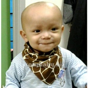 Example of a baby wearing bandana bib from Cozy Baby